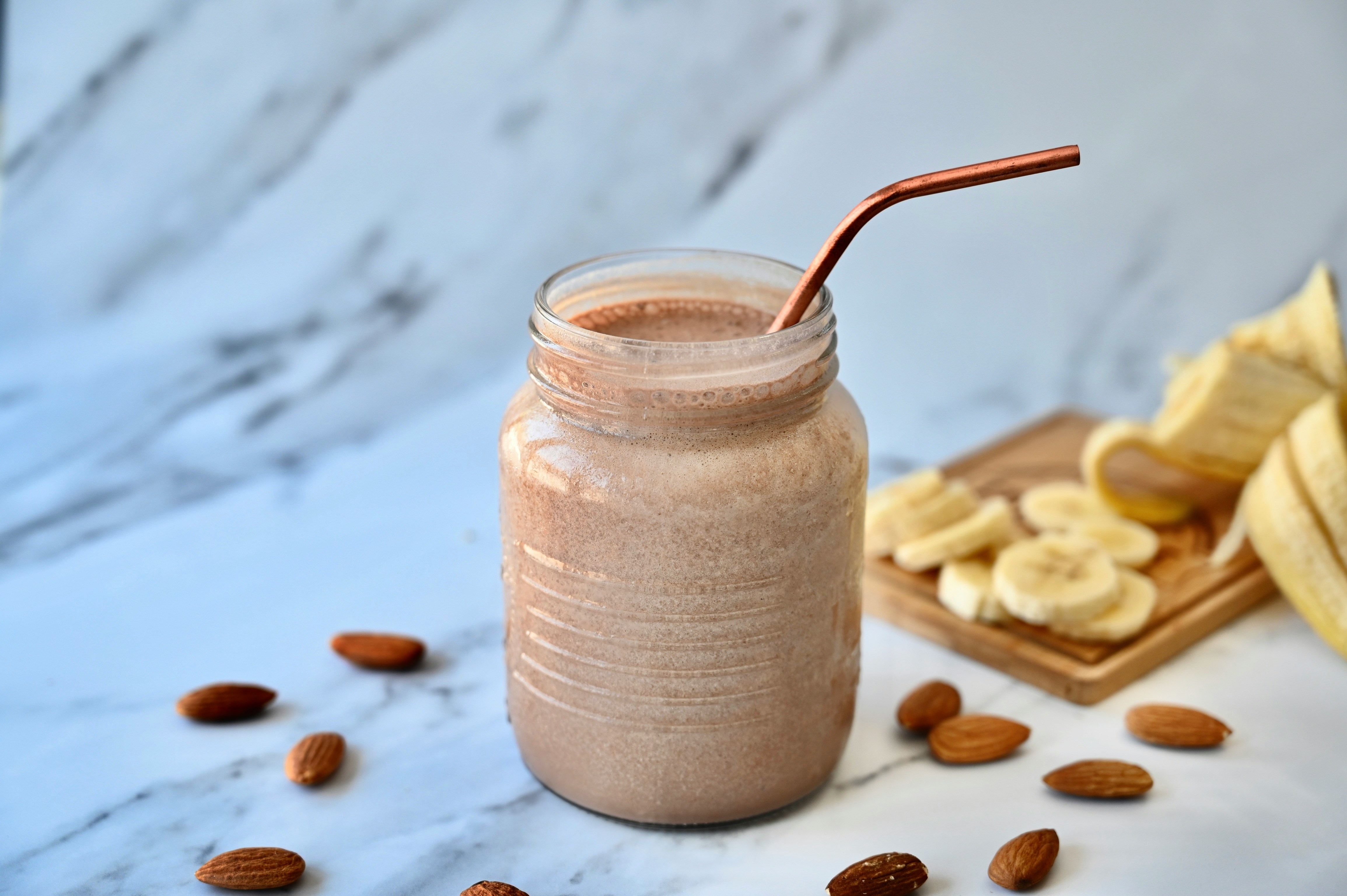 Power Smoothie in a glass with banana, Greek yogurt, oats, peanut butter, and 1% milk blended